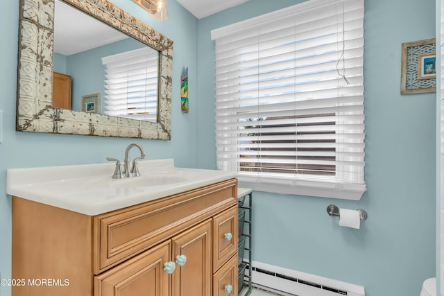 bathroom featuring vanity and a baseboard heating unit