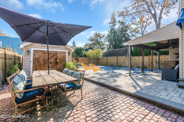 view of patio with an outdoor structure