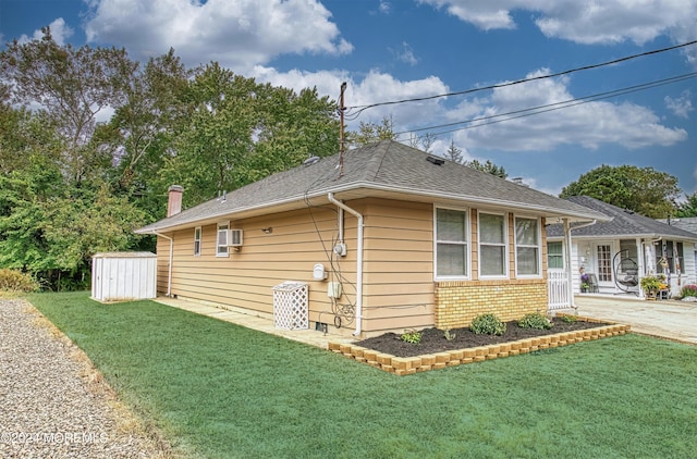 view of property exterior with a shed and a yard