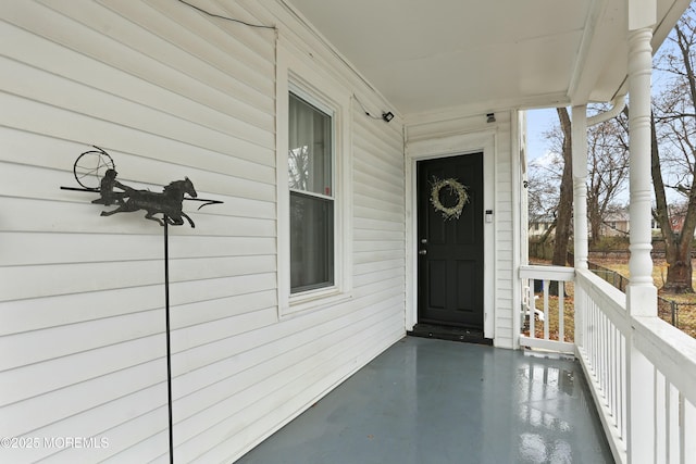 entrance to property with covered porch