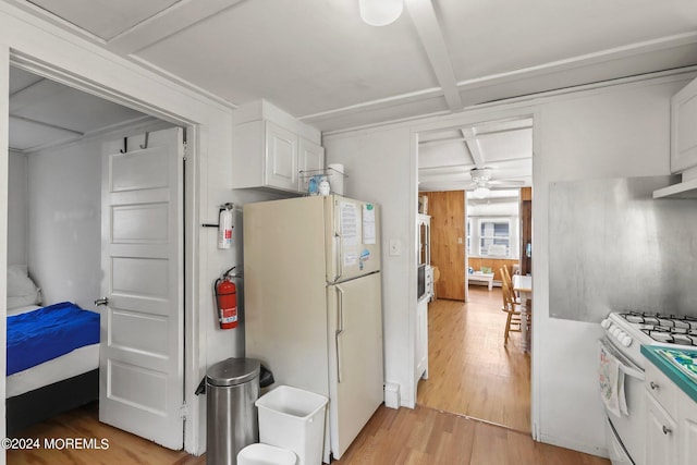 kitchen featuring coffered ceiling, white appliances, ceiling fan, light hardwood / wood-style flooring, and white cabinets