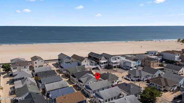 bird's eye view with a view of the beach and a water view