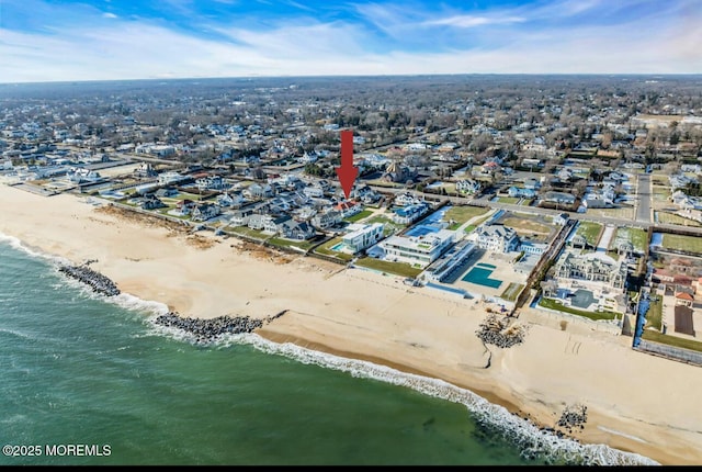 bird's eye view with a beach view and a water view