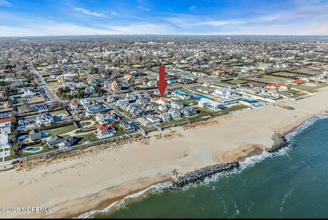 bird's eye view featuring a beach view and a water view