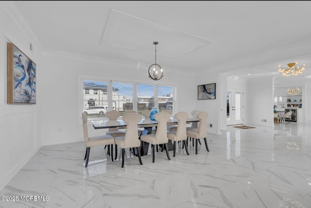 dining space featuring a notable chandelier and ornamental molding