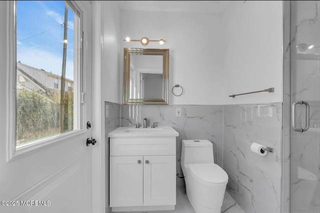 bathroom featuring vanity, tile walls, toilet, and walk in shower