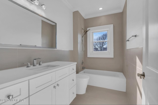 full bathroom with shower / tub combination, tile walls, vanity, decorative backsplash, and toilet