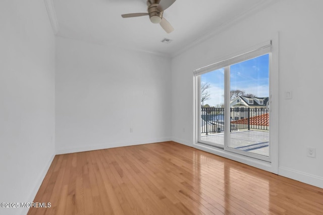 unfurnished room featuring hardwood / wood-style flooring, ceiling fan, and ornamental molding