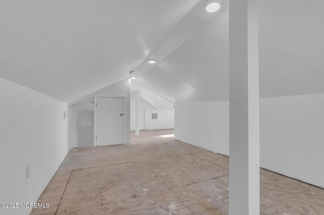 bonus room featuring vaulted ceiling