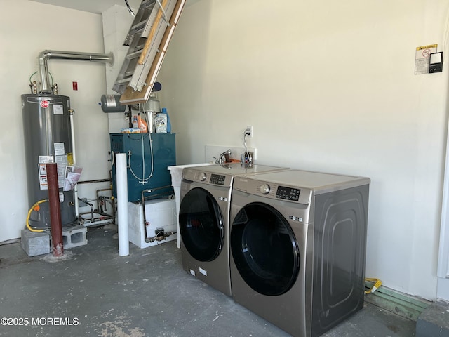 washroom featuring washer and dryer and gas water heater