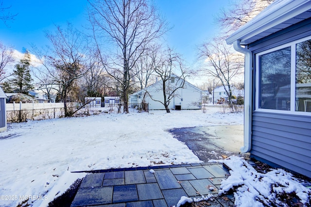 view of yard covered in snow