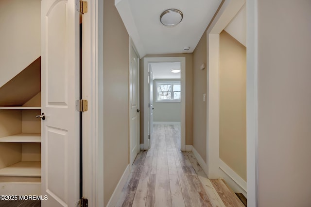 corridor featuring light hardwood / wood-style flooring