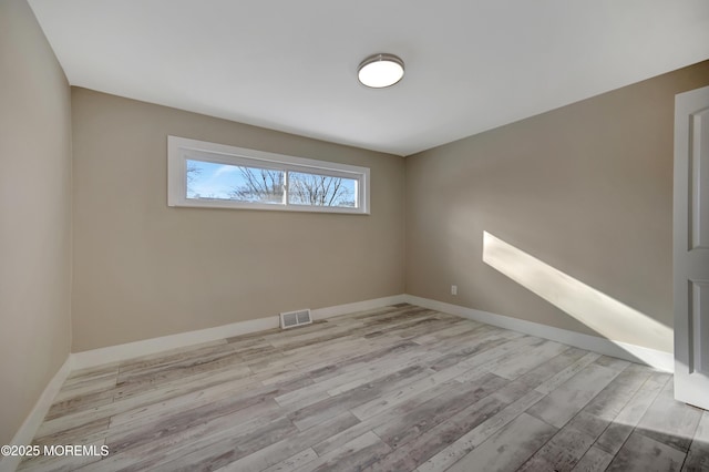 unfurnished room featuring light hardwood / wood-style flooring