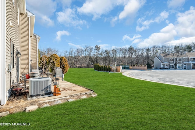 view of yard with central AC unit