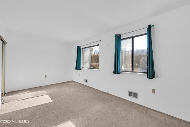 unfurnished bedroom with light carpet