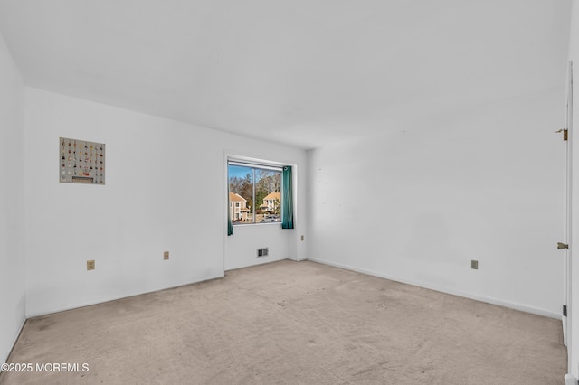 empty room with light colored carpet