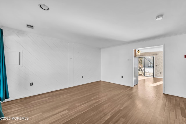 empty room featuring hardwood / wood-style floors and ceiling fan