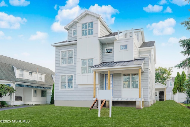 302 4th Ave, Belmar, NJ 07719 - rear view of house with a standing seam roof, a lawn, a metal roof, and roof with shingles