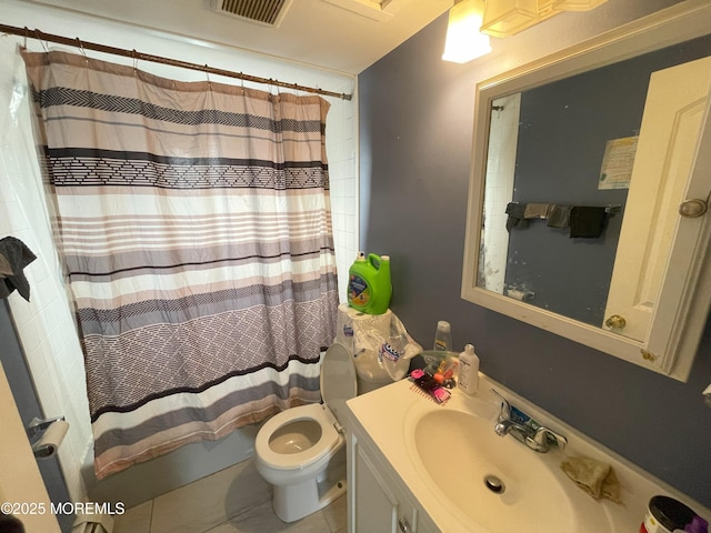 bathroom featuring tile patterned floors, curtained shower, vanity, and toilet