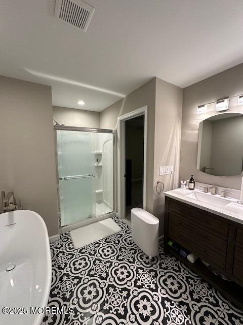 122 Orchid Ct Unit 1202, Toms River, NJ 08753 - bathroom with a shower stall, double vanity, a freestanding tub, and baseboards