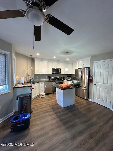 122 Orchid Ct Unit 1202, Toms River, NJ 08753 - kitchen with stainless steel appliances, dark countertops, white cabinets, ceiling fan, and recessed lighting