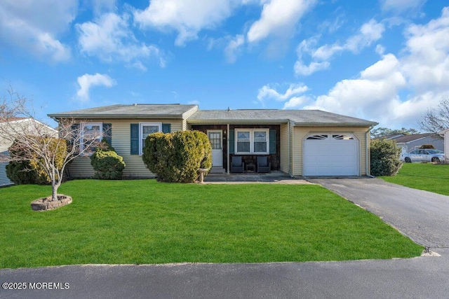 ranch-style home with a garage and a front yard