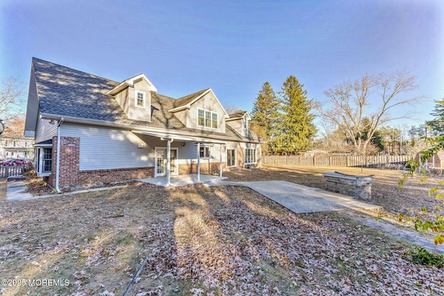 back of property featuring a patio