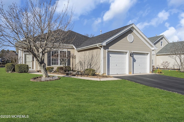 ranch-style home with a garage and a front lawn