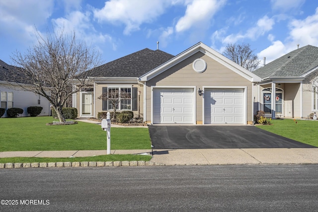 single story home featuring a front yard and a garage