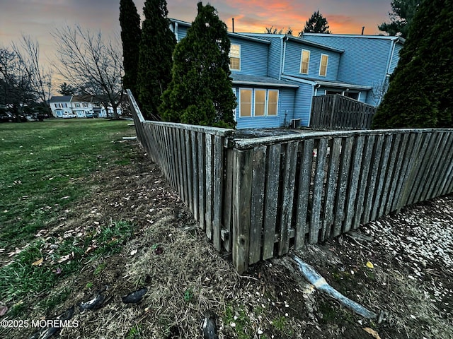 pool at dusk with a yard