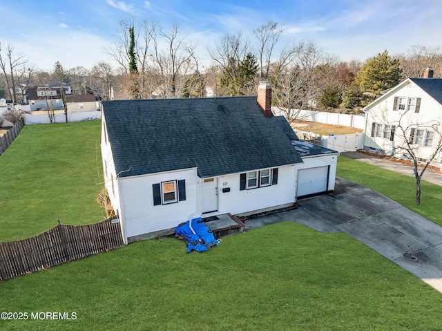 view of front facade featuring a garage and a front lawn