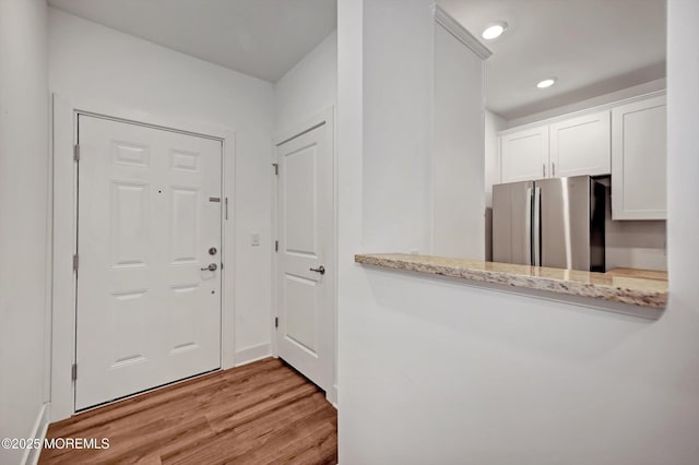 entrance foyer with light hardwood / wood-style floors