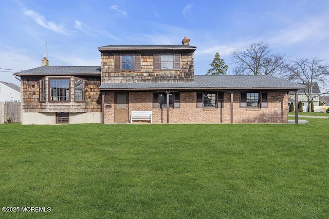 back of house featuring a yard