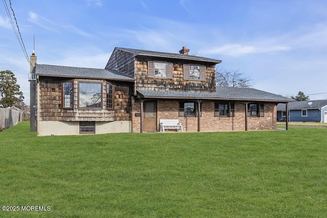 rear view of house with a lawn