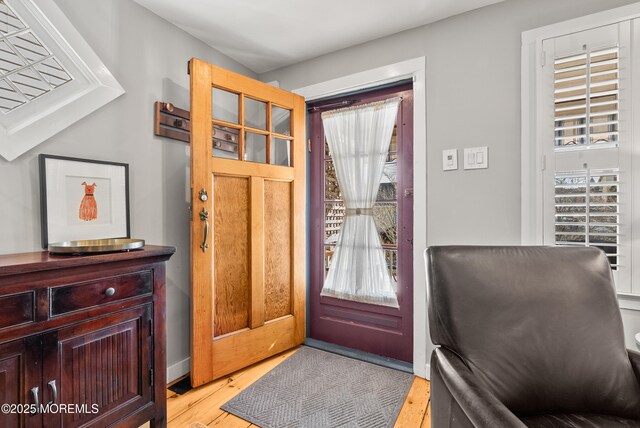 foyer featuring light wood-style floors