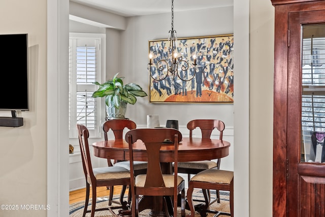 dining room with a wealth of natural light and a notable chandelier