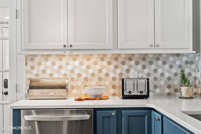 kitchen featuring light countertops, white cabinetry, dishwasher, and blue cabinetry