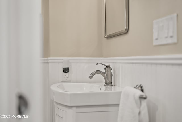 bathroom featuring wainscoting and vanity