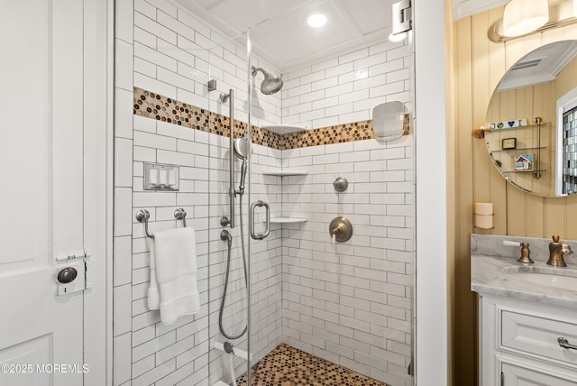 full bath with ornamental molding, a shower stall, and vanity