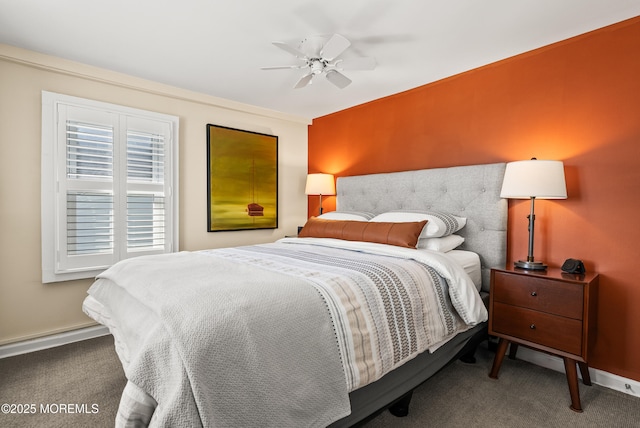 carpeted bedroom featuring a ceiling fan and baseboards