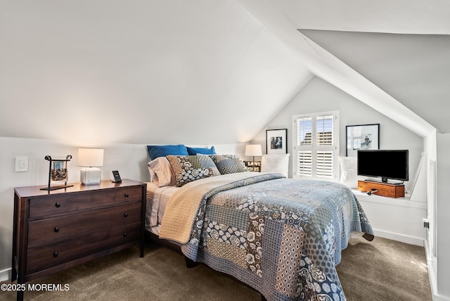 bedroom featuring lofted ceiling, baseboards, and carpet flooring