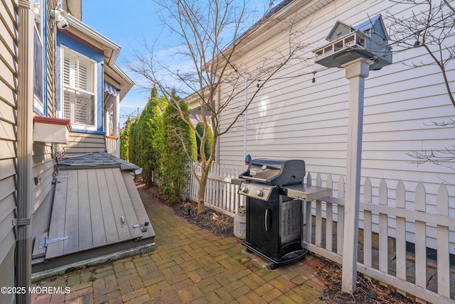 view of patio / terrace with fence and area for grilling