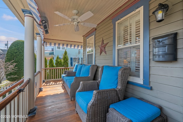 deck featuring a ceiling fan and a porch