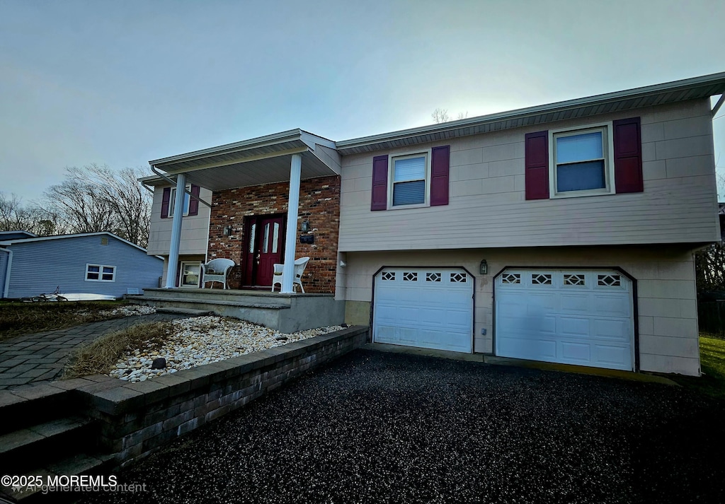 bi-level home featuring a garage