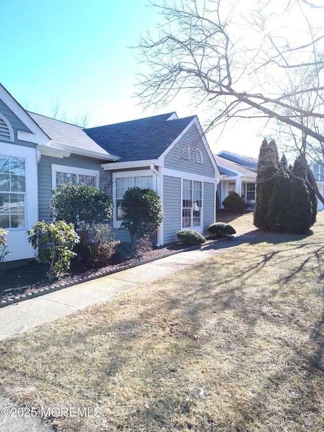 view of home's exterior with a yard