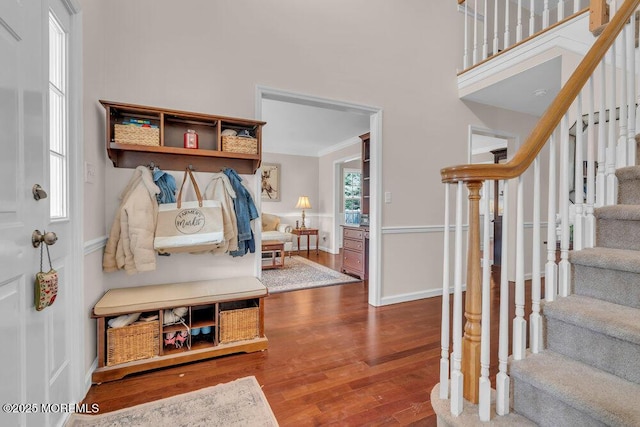 mudroom featuring hardwood / wood-style flooring and crown molding