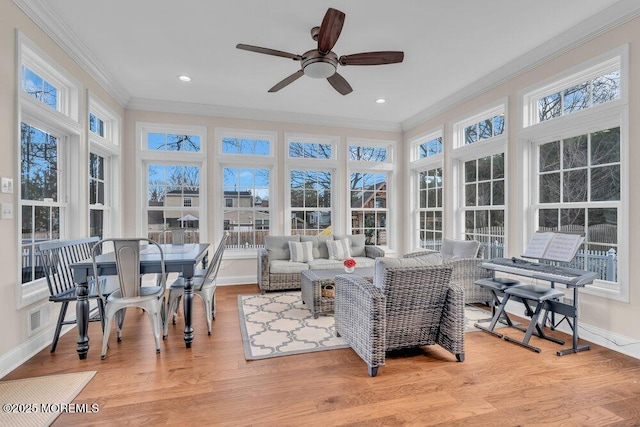 sunroom with ceiling fan