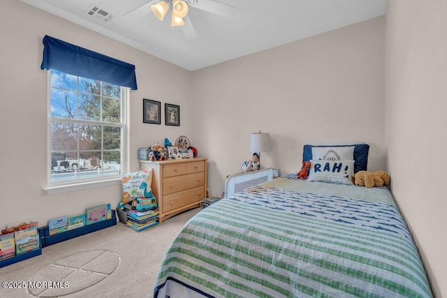 carpeted bedroom featuring ceiling fan