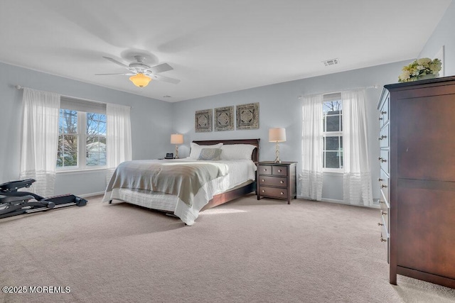 bedroom featuring light colored carpet and ceiling fan