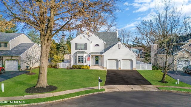 view of front property with a front yard and a garage